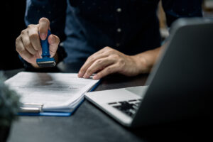 Man stamping a document